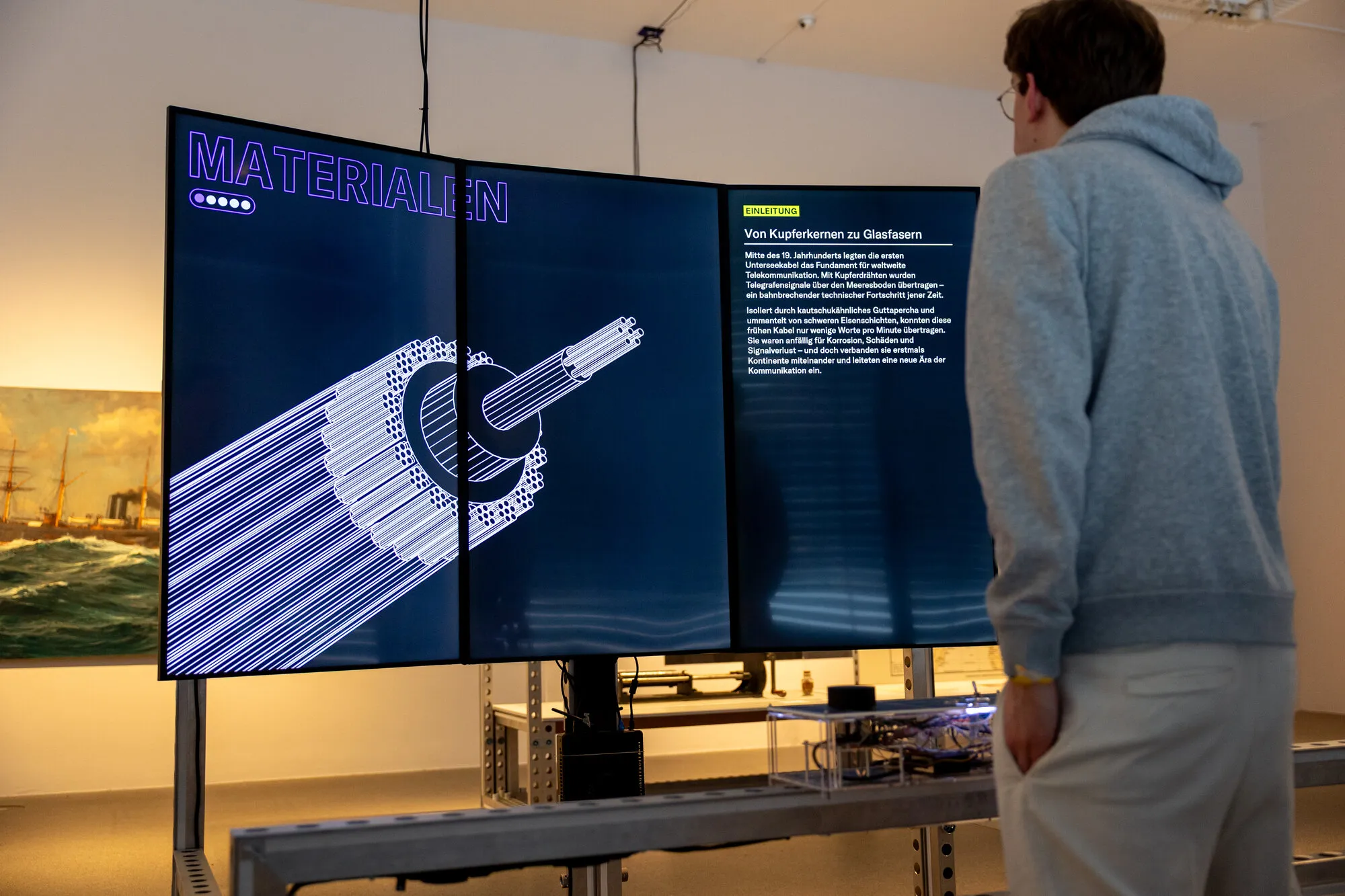 Visitors interacting with Cable Explorer